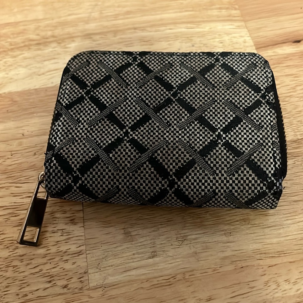A new day black and gray wallet. 4” height and 5” width. NWOT